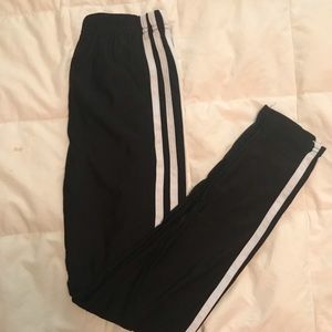 black leggings with 3 white stripes.
